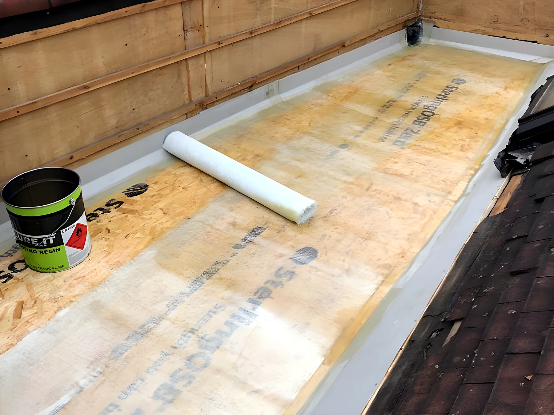New grey GRP flat roof finished with a clean upstand and trim